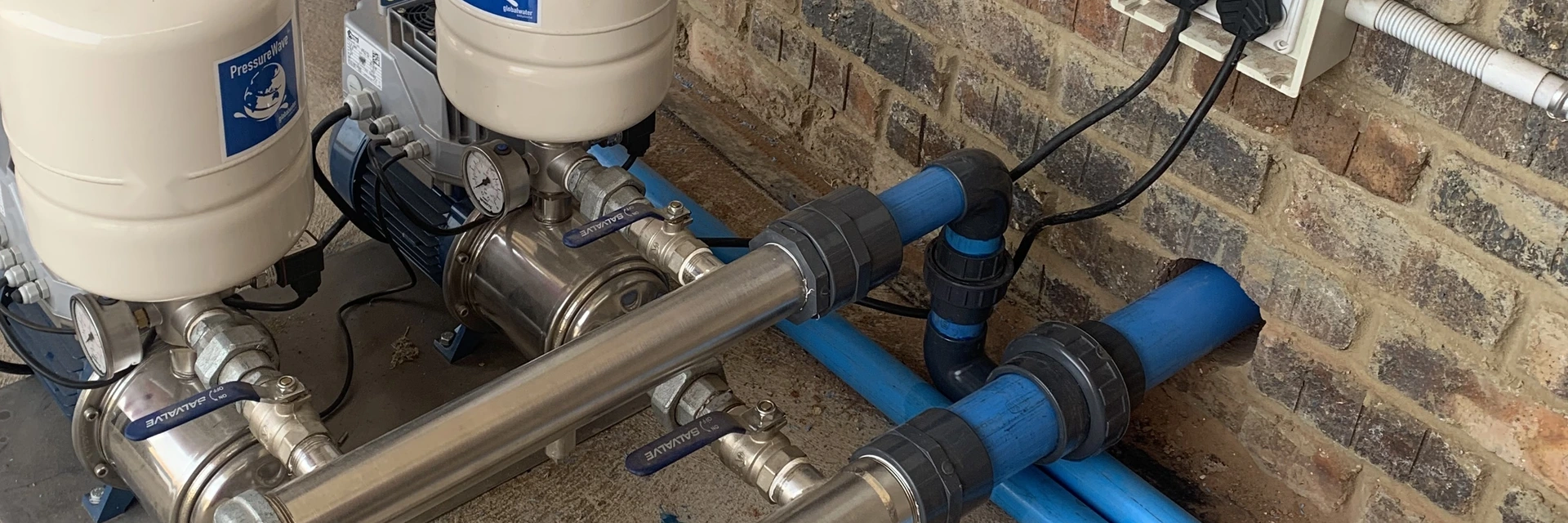 Dual booster pump pressure system with stainless steel manifold, ball valves, and digital control wiring